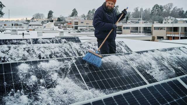 Man-with-solar-panels_SMALL
